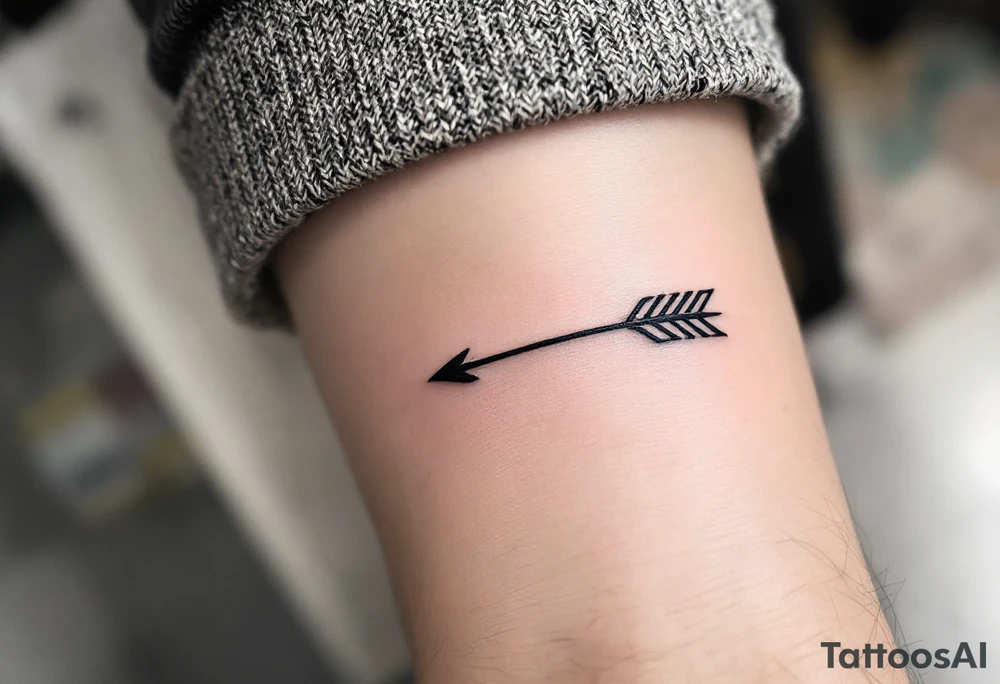 A sleek black ink arrow with a delicate gold accent running along its shaft, symbolizing elegance and direction. tattoo idea