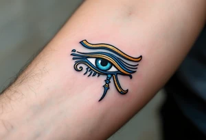 A blue and bronze Eye of Horus, detailed with ancient lines, placed on the forearm for protection and healing. tattoo idea