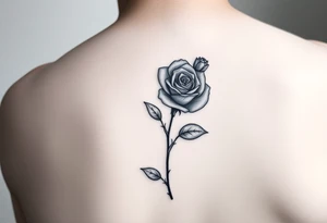 Delicate realistic tattoo in black and white, incorporating a forget me not in honour of our baby lost in early pregnancy, and a rose in honour of our son George Edward Hulbert (born on 14 June 2024) tattoo idea