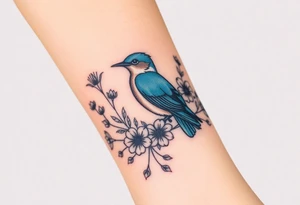 powerful majestic bluebird surrounded by wild flowers tattoo idea