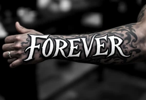 A bold, all-caps "FOREVER" in white ink across the knuckles, clean and simple. tattoo idea