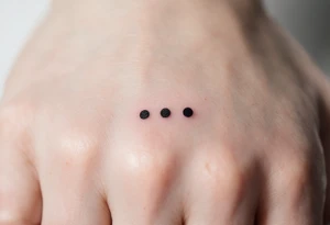 Three fine-line black dots in a row on the finger – Representing body, mind, and spirit in perfect alignment. tattoo idea