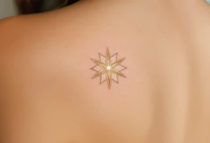 A shimmering gold eight-pointed star tattoo evokes celestial power and divine energy. tattoo idea