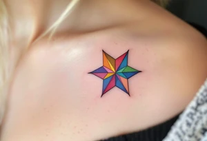 A rainbow-colored eight-pointed star tattoo celebrates inclusivity and universal love. tattoo idea
