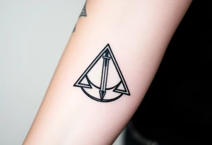 deathly hallows symbol from harry potter with a sword in the middle tattoo idea