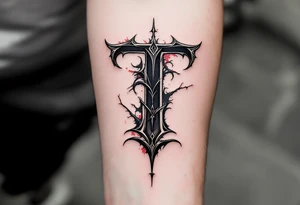 A bold black Gothic "T" with sharp serifs and subtle red shadowing. tattoo idea