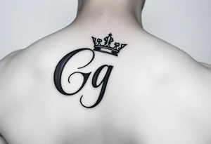 Capital G letter handwritten script with a crown tilted to the left on the front right shoulder tattoo idea