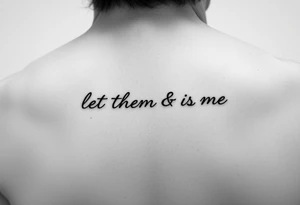 Small Fine line dainty cursive tattoo with the saying “let them & let me” on back tattoo idea