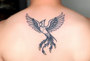 magnificent phoenix rising from golden flames with trailing embers tattoo idea
