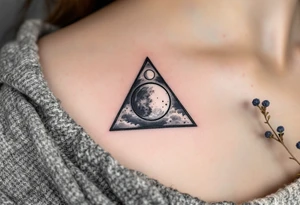A triangle with a lunar cycle inside, shaded in black and silver, symbolizing phases and intuition. tattoo idea