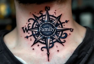 A classic black word "family" tattoo beneath a compass rose with deep navy and silver accents. tattoo idea