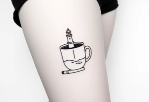 A mug of coffee
 with a picture of a 
 lighthouse on the the mug and a cigarette laying next to it tattoo idea