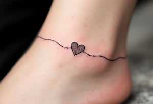 A fine-line black infinity band with a delicate heart in the shape of a fingerprint in maroon. tattoo idea