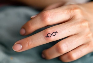 A rose band on finger with a small infinity symbol tattoo idea