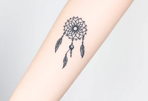 native dreamcatcher with flowing feathers and sacred beads tattoo idea