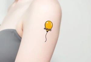 small yellow balloon with letters osaat on bicep tattoo idea