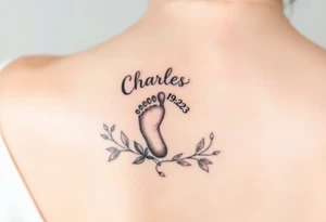 baby footprint print with the name Charles above it, the date 1-14-23 below it and surrounded by floral vines on a forearm tattoo idea