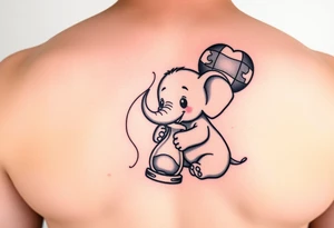 Baby elephant next to hour glass holding autism balloon tattoo idea