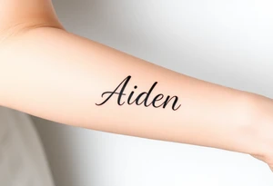The name Aiden thick
 and bold cursive tattoo idea
