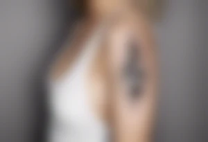 Minimalist line work tattoo, depicting musical
Notes and the letters “R” and “L”. tattoo idea