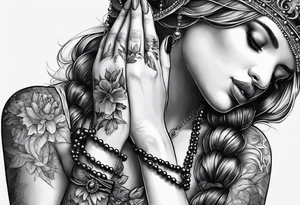 A woman’s praying hands holding a rosary catholic style tattoo idea