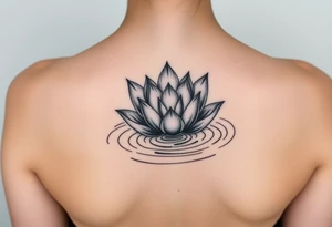 serene lotus flower emerging from sacred waters with ripples tattoo idea