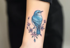 powerful majestic bluebird surrounded by wild flowers tattoo idea