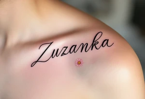 Zuzanka written in gentle cursive, nestled among pastel pink and white daisies tattoo idea
