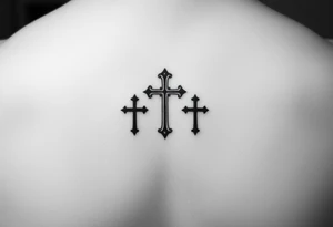 3 crosses side by side to form what looks like a ring on top of the 4th finger. elegant, simple tattoo idea