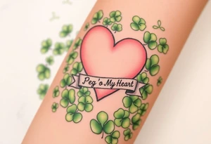 a big pale pink heart in a huge patch of green shamrocks, with a banner across the heart that says Peg 'o My Heart tattoo idea