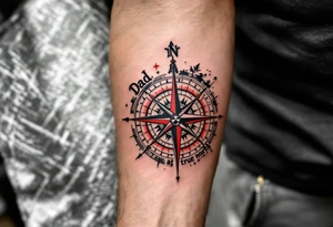 A traditional-style compass with red and black detailing, pointing toward “Dad” at true north. tattoo idea