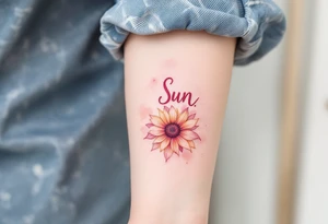 Word "Sun" written vertical with small sunflower in pink tattoo idea