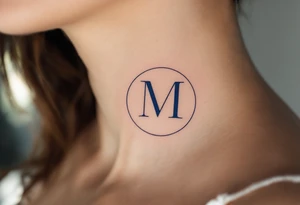 An elegant serif "M" in midnight blue, placed within a fine circular frame. tattoo idea