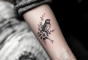 Bird with flowers tattoo idea