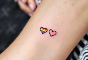 Tiny rainbow hearts behind each ear to honor love in every shade. tattoo idea