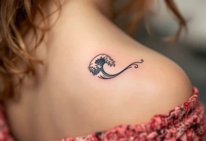 A tiny black wave with delicate shading curls on the side of the finger, simple and elegant. tattoo idea