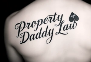 Lettering in calligraphy/cursive that says:
Property of
Daddy Law

(Somewhere in there a queen of spades. 
Area of tattoo: ass
) tattoo idea