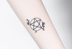 Enneagram symbol with fine line florals tattoo idea