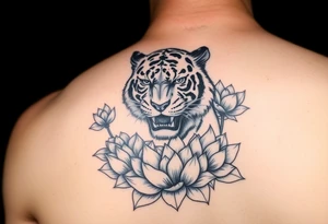 fierce tiger emerging through blooming lotus flowers in mist tattoo idea
