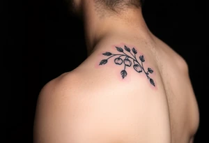 colored tattoo on the shoulder with the image of an oak branch and poppy seeds tattoo idea