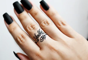 Name on ring finger tattoo idea