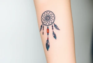 native dreamcatcher with flowing feathers and sacred beads tattoo idea