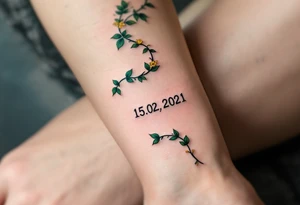 Luyky 15. 02. 2021 – Deep emerald green vine twisting around Lucas's birthdate, with small yellow blooms dotting the numbers. tattoo idea