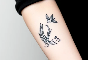 Skeleton hand reaching out of the ocean for a flying swallow in the Sailor Jerry style tattoo idea