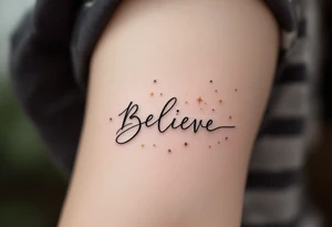 A minimalist "Believe" in black ink, with small stars in gold scattered across, symbolizing faith in one's dreams. tattoo idea