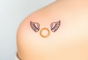 A golden wedding band floating within an angelic halo, glowing softly. tattoo idea