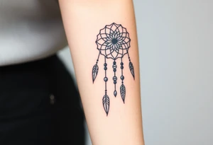 native dreamcatcher with flowing feathers and sacred beads tattoo idea