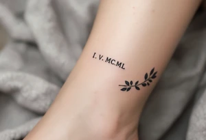 Tiny I.V.MCML on the ankle in black, paired with grayscale olive branches extending around the leg tattoo idea