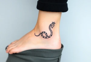 I want a small simple silhouette lines black and white wrist princess like girl snake tattoo that has number 12821 on its body along and also I want it to represent feminine energy crown queen Cycle tattoo idea