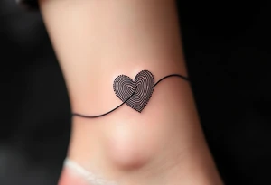 A fine-line black infinity band with a delicate heart in the shape of a fingerprint in maroon. tattoo idea